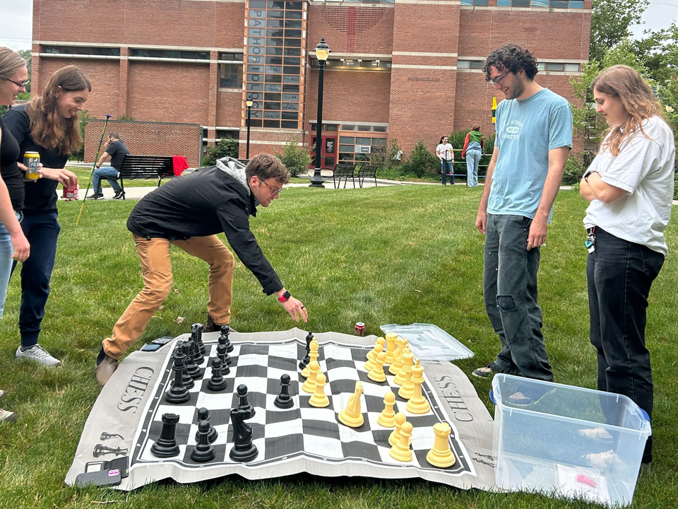 Students playing lawn chess